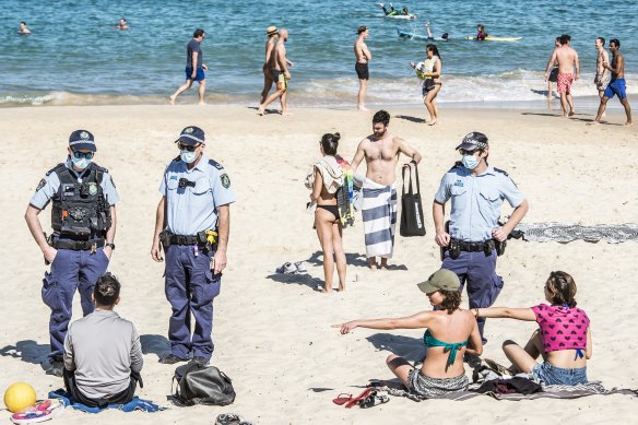Police patrolling Bondi Beach to enforce compliance with the COVID-19 lockdown restrictions.