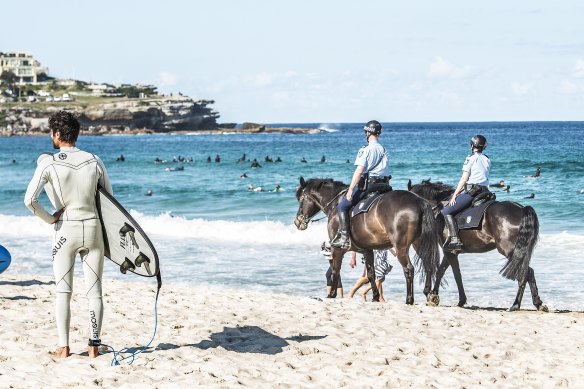 Police patrol at Bondi to enforce COVID-19 restrictions in August 2021.