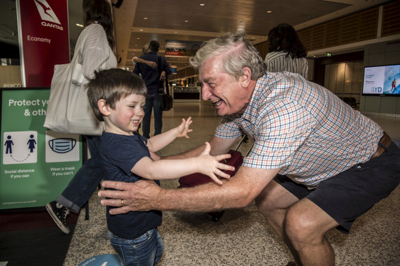 Alan Kinkade being greeted by Tom for the first time in months at Sydney Airport on Monday.