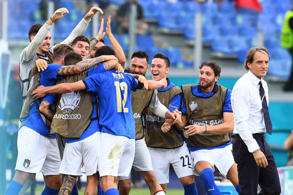 The Italians celebrate Matteo Pessina’s goal against Wales.