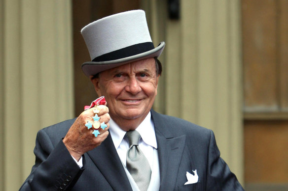 The late Barry Humphries pictured with his OBE in 2007.
