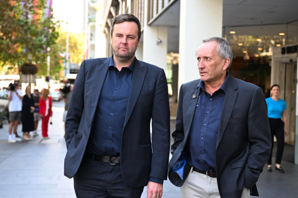 Rail Tram and Bus Union state secretary Toby Warnes (left) and president Craig Turner outside the Fair Work building on Wednesday.