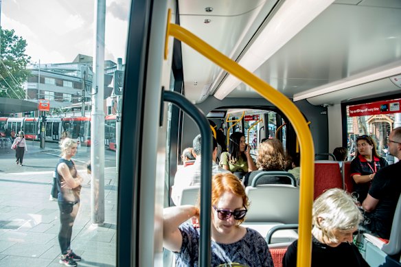 Commuters on the Sydney light rail during peak hour on Monday morning.