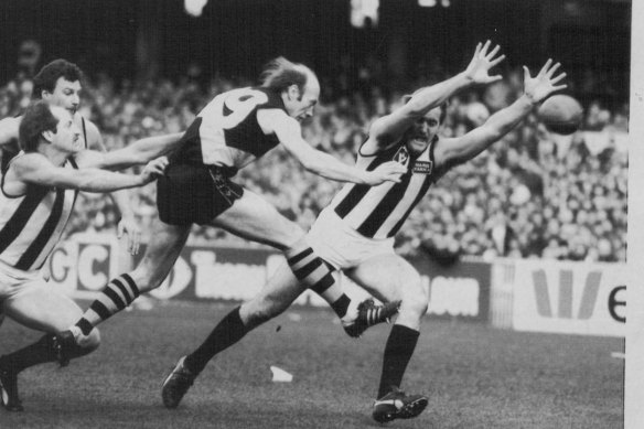Craig Stewart (right) trying to smother a kick in 1983. 