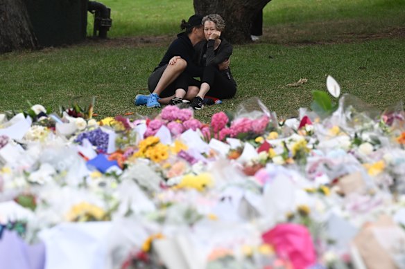 Mourners gather at the Bondi Pavilion memorial on Tuesday.