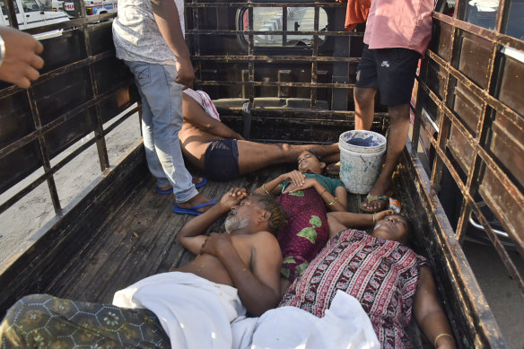 People affected by the chemical gas leak are carried in a truck for medical treatment in Vishakhapatnam, India. 