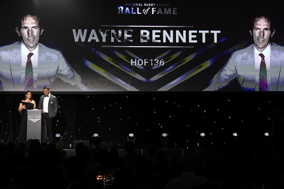 Sam Burgess accepts Wayne Bennett’s award on his behalf.