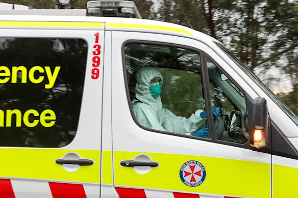 An ambulance drives out of the Anglicare Newmarch House at Caddens in Sydney's west.