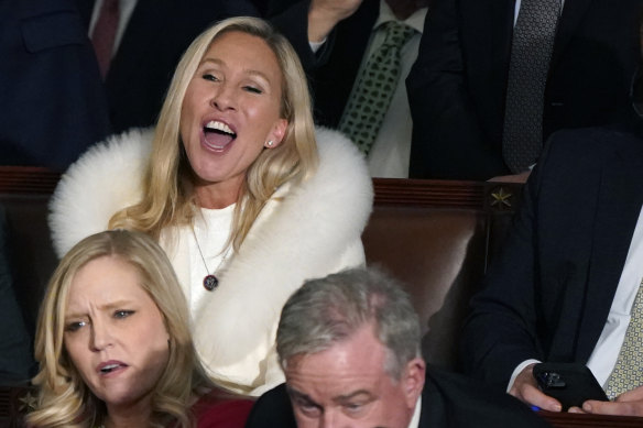 Representative Majorie Taylor Greene listens and reacts as President Joe Biden delivers his State of the Union speech to a joint session of Congress, at the Capitol in Washington.