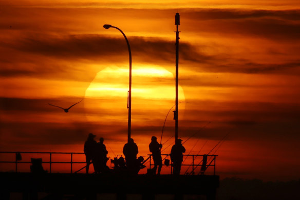 The sun rises over Melbourne during a heatwave in 2018.