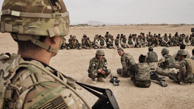 US Army soldiers oversee training of Afghan National Army soldiers at Camp Bastion, Helmand Province, Afghanistan.