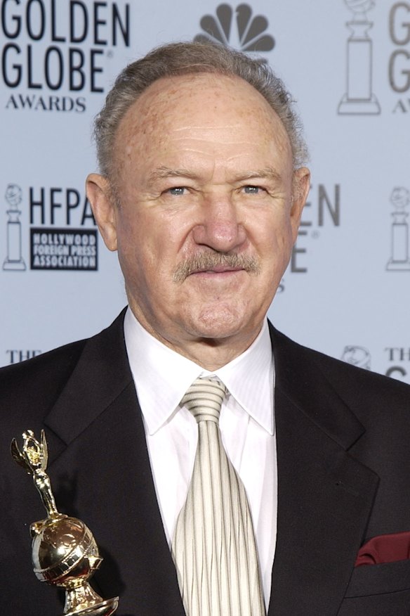 Gene Hackman poses with his Cecil B. De Mille Award backstage during the Golden Globe Awards in 2003.