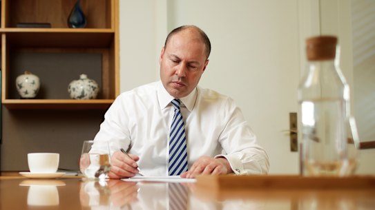 Treasurer Josh Frydenberg in his office working on his speech ahead of delivering his economic statement.