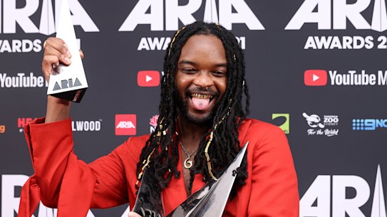 Genesis Owusu poses with his four ARIA Awards.