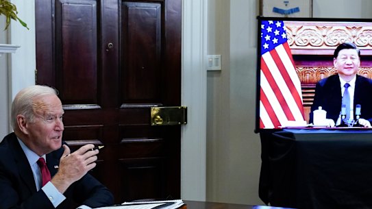 President Joe Biden meets virtually with Chinese President Xi Jinping from the Roosevelt Room of the White House in Washington.