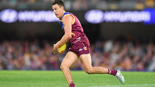 BRISBANE, AUSTRALIA - JUNE 11: Hugh McCluggage of the Lions runs with the ball before kicking a goal during the round 13 AFL match between the Brisbane Lions and the St Kilda Saints at The Gabba on June 11, 2022 in Brisbane, Australia. (Photo by Albert Perez/AFL Photos/via Getty Images)