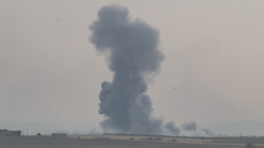 Smoke rises over the Syrian town of Tel Abyad, as seen from the Turkish border town of Akcakale.