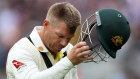 David Warner walks off after being dismissed.