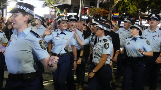NSW Police Commissioner Karen Webb (centre) marches with colleagues in the 2023 Mardi Gras parade.
