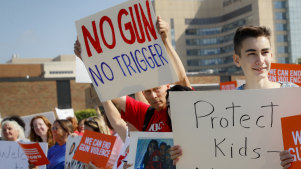 Demonstrators gather to protest the arrival of US President Donald Trump outside Miami Valley Hospital in Ohio.