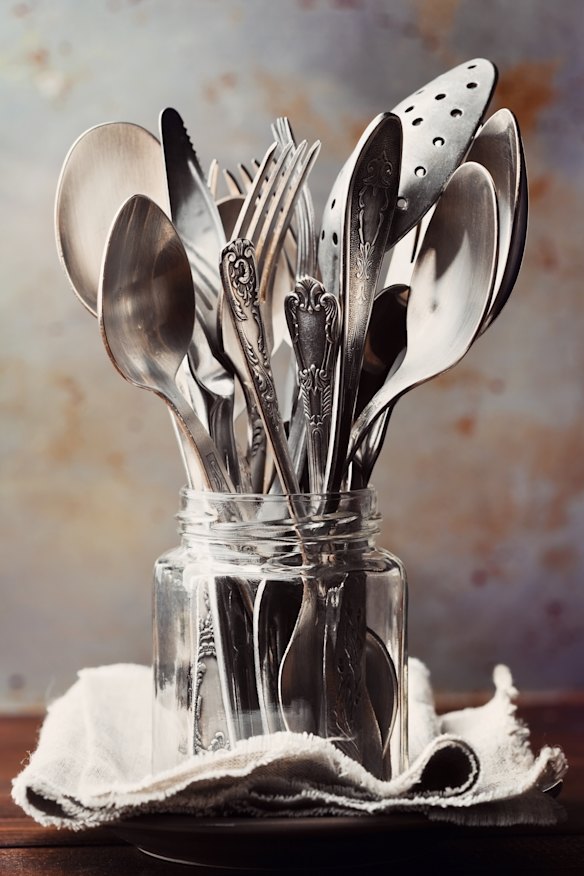 Spare vintage cutlery can be stored in a vase or old jars.