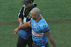 Braydon Trindall leaves the field with a shoulder injury.
