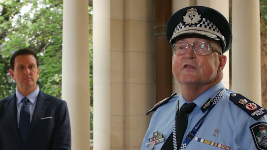 Queensland Police Commissioner Steve Gollschewski (right).