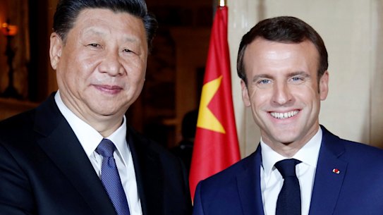 Chinese President Xi Jinping, left, is welcomed by French President Emmanuel Macron in Beaulieu-sur-Mer, southern France in 2019.