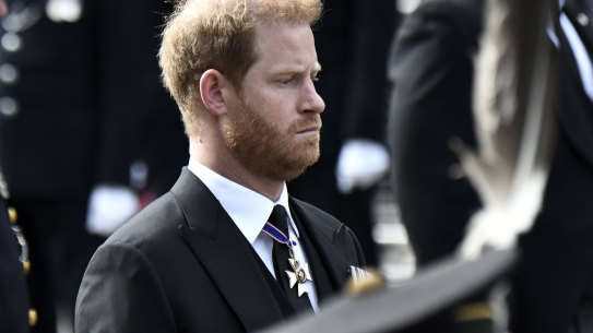 Britain’s Prince Harry follows the coffin of Queen Elizabeth II during her funeral procession from Westminster Abbey to Wellington Arch in London, Monday, Sept. 19, 2022. (Stephane de Sakutin/Pool Photo via AP)