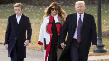 US President Donald Trump with first lady Melania Trump and their son Barron. Trump says he wouldn't steer Barron towards American football, calling it "a dangerous sport."