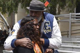 Ernie Dingo comforts JCâ€™s sister. 