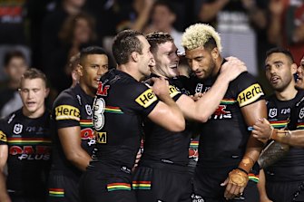 Yeah, baby ... Viliame Kikau is congratulated after denying Justin Olam the winning try.