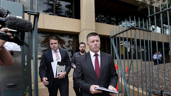 Mike Gallacher leaving Parliament after resigning as police minister in 2014.