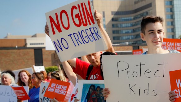 Demonstrators gather to protest the arrival of US President Donald Trump outside Miami Valley Hospital in Ohio. 