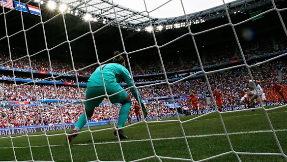 Megan Rapinoe scores the opening goal from the spot.