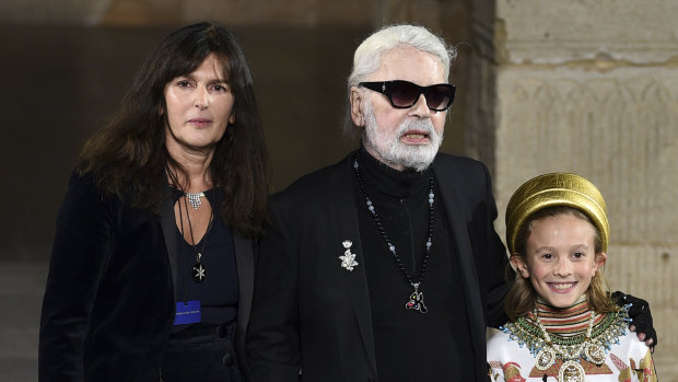 Virginie Viard, left, with Karl Lagerfeld and his godson Hudson Kroenig during the finale of the Chanel Metiers d'Art 2018/19 Show at the Metropolitan Museum of Art on Tuesday, December 4, 2018, in New York. 