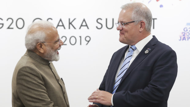 Prime Minister Scott Morrison with the Prime Minister of India, Narendra Modi, during the G20 summit. The pair were seated next to each other at an official dinner.