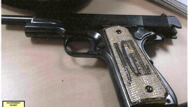 A diamond-encrusted pistol, monogrammed with the initials of  Joaquin 'El Chapo' Guzman Loera.
