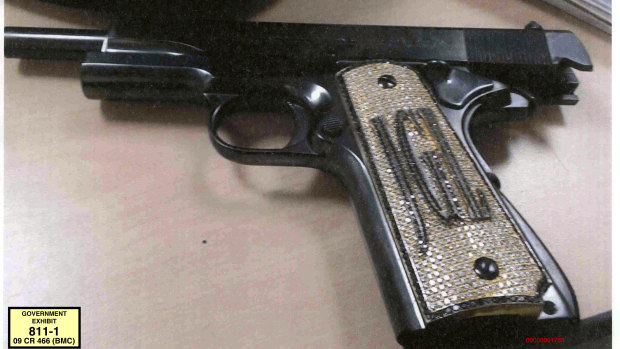 A diamond-encrusted pistol, monogrammed with the initials of  Joaquin "El Chapo" Guzman.