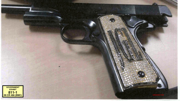 A diamond-encrusted pistol that a government said belonged to "El Chapo", monogrammed with his initials JGL - Joaquin Guzman Loera.