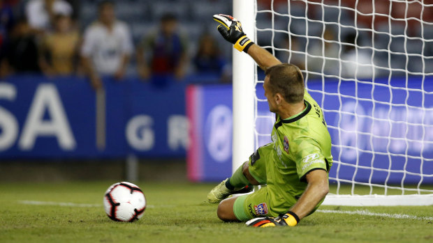 Hero of the day: Newcastle goalkeeper Glen Moss saves a late penalty during the draw with Wellington.