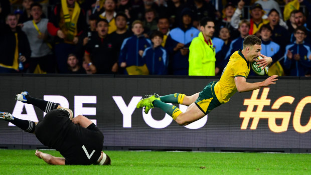Nic White leaps in the air before scoring in Saturday's Bledisloe Cup opener in Perth. 