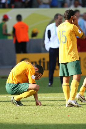 Australian players look devastated after Italy kicks the winning goal off a penalty.