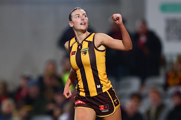 Aine McDonagh of the Hawks celebrates kicking a goal.