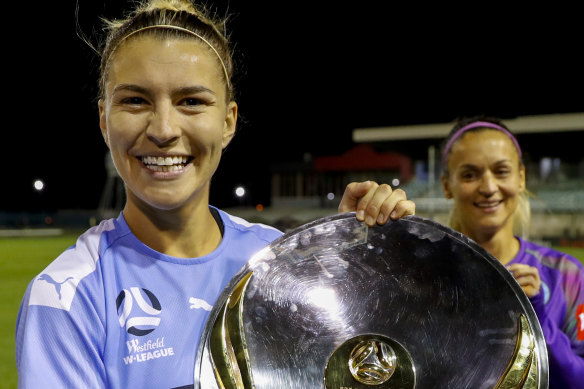 City's Stephanie Catley  with the W-League trophy.