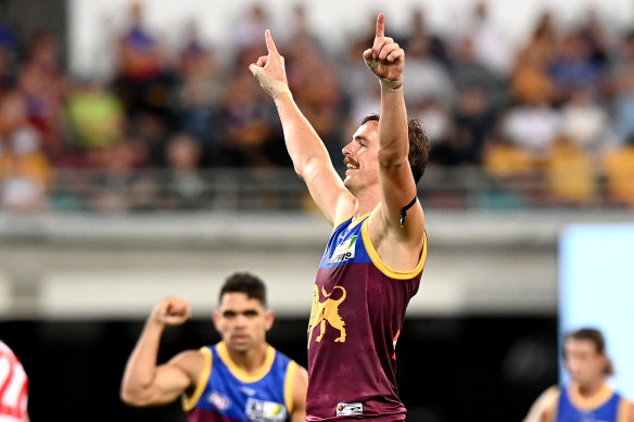 Joe Daniher celebrates after kicking a goal for the Lions.