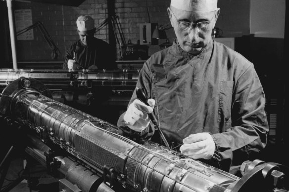 In 1967, a British technician assembles one of the world’s early undersea cables in “clinic-like conditions” to stop dust being sealed inside.