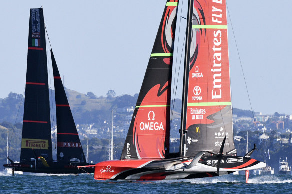 Italy’s Luna Rossa, left, races against Team New Zealand during race six.
