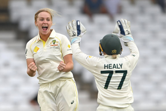 Australia's Kim Garth celebrates a wicket with Alyssa Healy in last year's Test against England.