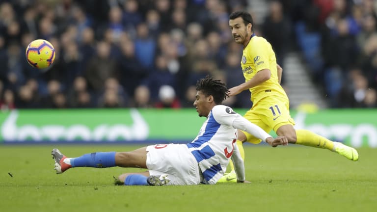 Brighton's Bernardo and Chelsea's Pedro vie for the ball at the Amex Stadium in Brighton.